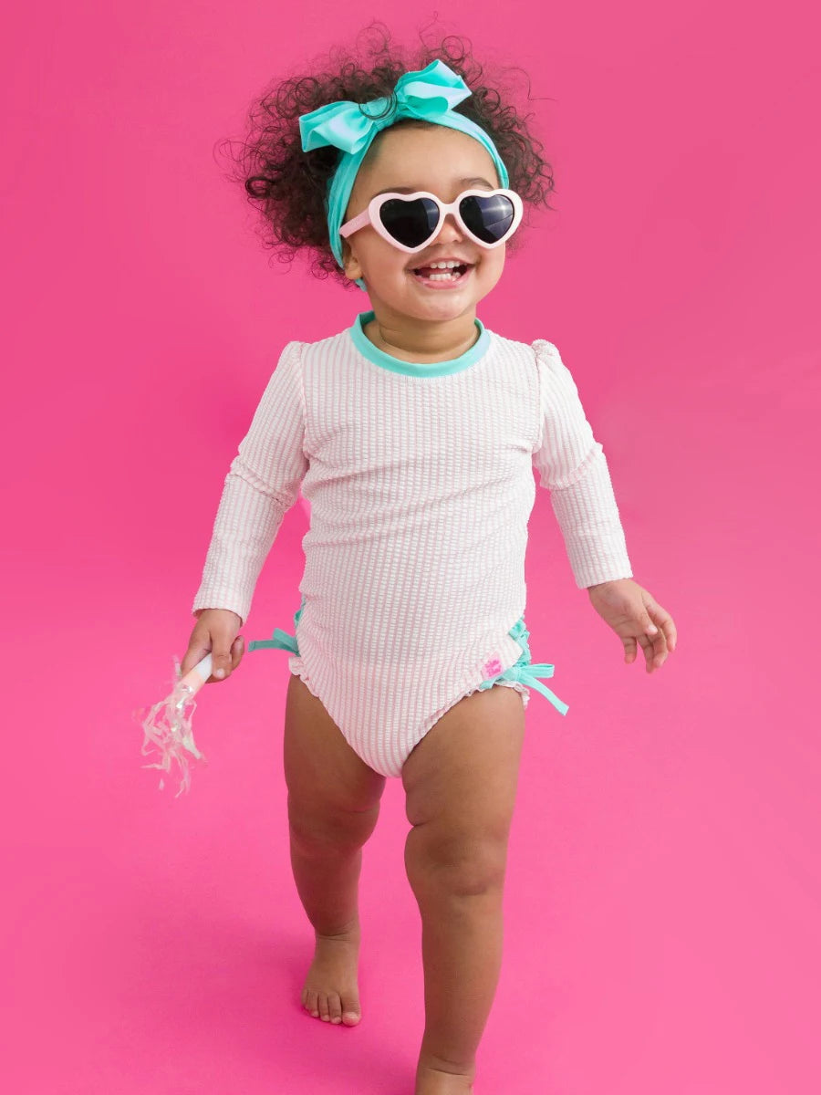 Pink Seersucker LS One Piece Rash Guard